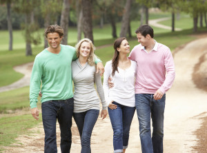 Group of friends enjoying walk in park